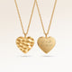 Personalized heart-shaped gold necklace with rippled wave surface and space for engraving of text, coordinates or handwriting on the back
