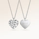 Personalized heart-shaped silver necklace with rippled wave surface and space for engraving of text, coordinates or handwriting on the back