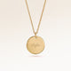 Personalized round gold necklace with space for engraving of text, coordinates or handwriting on the front and back