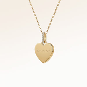Personalized heart-shaped gold necklace with white zircons and space for engraving of text, coordinates or handwriting on the front and back
