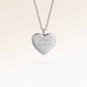 Personalized heart-shaped silver necklace with space for engraving of text, coordinates or handwriting on the front and back