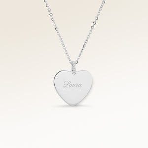 Personalized heart-shaped silver necklace with white zircons and space for engraving of text, coordinates or handwriting on the front and back