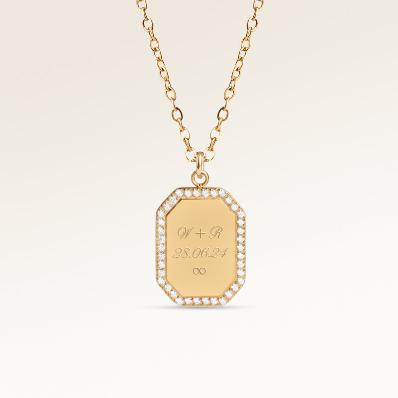 Personalized octagonal gold necklace with white zircons along the edge and space for engraving of 8 characters on one line on the front