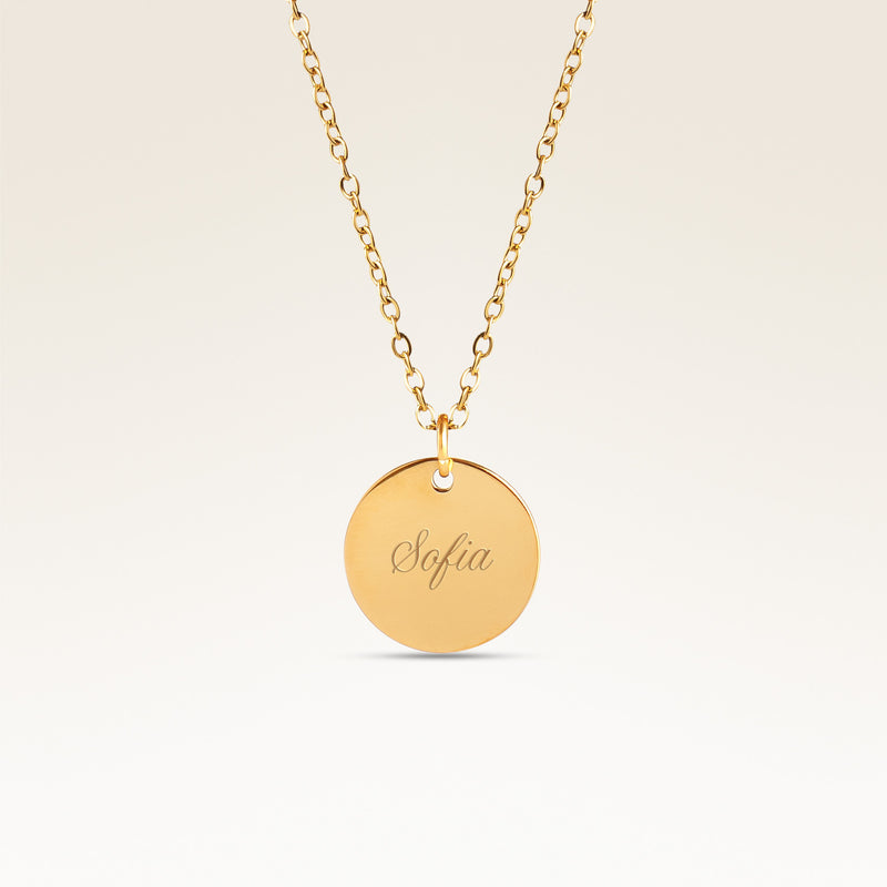 Personalized round gold necklace with space for engraving of text, coordinates or handwriting on the front and back