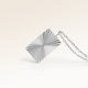 Close-up of minimalist square pendant in silver with ribbed sunburst surface and space for engraving on back